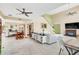 Spacious living room with high ceilings, fireplace, and ample natural light at 621 E Wildmere Ave, Longwood, FL 32750
