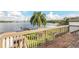 Elevated deck overlooking lake, backyard, and playset at 621 E Wildmere Ave, Longwood, FL 32750