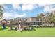 Spacious backyard with hot tub, gazebo, and playground at 621 E Wildmere Ave, Longwood, FL 32750