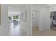Spacious hallway with tile flooring and views into other rooms at 2638 Sage Valley Way, Winter Haven, FL 33884
