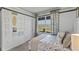 Bedroom with full bed, window and coastal decor at 2638 Sage Valley Way, Winter Haven, FL 33884
