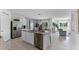 Open concept kitchen with island and views into living area at 2638 Sage Valley Way, Winter Haven, FL 33884