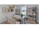 Home office with a desk, built-in shelving and window at 2638 Sage Valley Way, Winter Haven, FL 33884