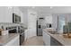 Modern kitchen with stainless steel appliances and ample counter space at 2638 Sage Valley Way, Winter Haven, FL 33884