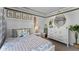 Bedroom with surfing decor and full-size bed at 2638 Sage Valley Way, Winter Haven, FL 33884