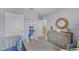 Bedroom with dresser, changing table and beach decor at 2638 Sage Valley Way, Winter Haven, FL 33884