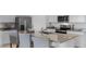 Kitchen island with granite countertop and seating for three at 2634 Sage Valley Way, Winter Haven, FL 33884