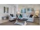 Living room with light-colored couch and armchairs at 2634 Sage Valley Way, Winter Haven, FL 33884
