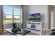 Bright living room with large windows and a view of nature at 2634 Sage Valley Way, Winter Haven, FL 33884