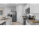Modern kitchen featuring stainless steel appliances and granite countertops at 2634 Sage Valley Way, Winter Haven, FL 33884