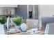 Table setting for six with fresh greenery at 2634 Sage Valley Way, Winter Haven, FL 33884