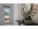 Front entry with a console table and mirror at 2634 Sage Valley Way, Winter Haven, FL 33884