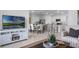 Open living room showcasing a kitchen, dining area, and comfy seating at 2634 Sage Valley Way, Winter Haven, FL 33884