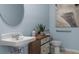 Small bathroom with pedestal sink and toilet at 2634 Sage Valley Way, Winter Haven, FL 33884