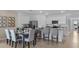 Open concept kitchen with island and dining area at 2634 Sage Valley Way, Winter Haven, FL 33884