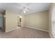 Well-lit bedroom with carpet flooring and access to a full bathroom at 3478 Westchester Square Blvd # 204, Orlando, FL 32835