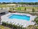 Community pool with lounge chairs and surrounding landscaping at 6122 Galloping Dr, Apopka, FL 32712