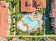 Aerial view of community pool and surrounding buildings at 906 Charo Pkwy # 433, Davenport, FL 33897