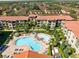 Drone view of apartment community, showcasing pool and landscaping at 906 Charo Pkwy # 433, Davenport, FL 33897