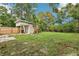 Large backyard with shed and grassy area, perfect for outdoor activities at 4221 Mizell St, Orlando, FL 32812