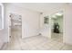 Tiled dining room with access to living room and laundry areas at 4221 Mizell St, Orlando, FL 32812