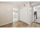 Simple bedroom with wood-look floors and a view of the kitchen at 4221 Mizell St, Orlando, FL 32812
