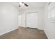 Bedroom with carpet flooring, double closet, and window at 4221 Mizell St, Orlando, FL 32812
