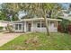 Charming house exterior with a covered porch and well-maintained lawn at 4221 Mizell St, Orlando, FL 32812