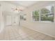 Spacious bedroom with tile flooring and ceiling fan at 4221 Mizell St, Orlando, FL 32812