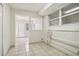 Laundry room with tiled floors, and access to backyard at 4221 Mizell St, Orlando, FL 32812