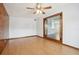 Spacious living room with wood-look floors and access to another room at 4221 Mizell St, Orlando, FL 32812