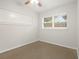 Bright bedroom with carpet flooring and window at 4221 Mizell St, Orlando, FL 32812