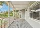 Inviting front porch with white railings and grey flooring at 4221 Mizell St, Orlando, FL 32812