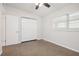Bedroom with carpet flooring, double closet, and window at 4221 Mizell St, Orlando, FL 32812