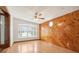 Cozy Gathering room with wood paneled accent wall and bay window at 4221 Mizell St, Orlando, FL 32812