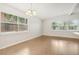 Bright dining room with two large windows and a chandelier at 4221 Mizell St, Orlando, FL 32812