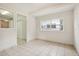 Simple dining room with tiled floors and window at 4221 Mizell St, Orlando, FL 32812