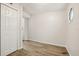 Bright bedroom with wood-look floors and a double door closet at 4221 Mizell St, Orlando, FL 32812