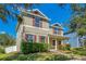 Two-story house with green siding, brown shutters, and a front porch at 2053 Nobscot Pl, Apopka, FL 32703