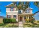 Two-story house with green siding, brown shutters, and a front porch at 2053 Nobscot Pl, Apopka, FL 32703