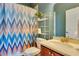 Clean bathroom with single vanity and chevron shower curtain at 2053 Nobscot Pl, Apopka, FL 32703