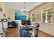 Home office with wood floors, large windows, and work desk at 2053 Nobscot Pl, Apopka, FL 32703