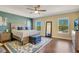 Large bedroom with king-size bed, hardwood floors, and large windows at 2053 Nobscot Pl, Apopka, FL 32703