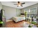 Cozy bedroom with wood floors and multiple plants at 2053 Nobscot Pl, Apopka, FL 32703