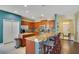 Modern kitchen with an island, stainless steel appliances, and hardwood floor at 2053 Nobscot Pl, Apopka, FL 32703