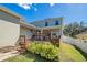 Landscaped backyard with deck and privacy fence at 2053 Nobscot Pl, Apopka, FL 32703
