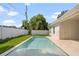 Inviting pool with surrounding grass and fence at 1020 W Princeton St, Orlando, FL 32804