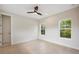 Spacious bedroom with hardwood floors and ceiling fan at 1020 W Princeton St, Orlando, FL 32804