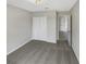 Bright bedroom with neutral walls and carpet, featuring a double-door closet at 10472 Eastpark Lake Dr, Orlando, FL 32832