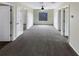 Spacious bonus room with carpeted floors and ceiling fan at 10472 Eastpark Lake Dr, Orlando, FL 32832